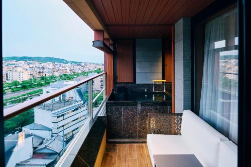 a balcony with a view of a city at Sora Niwa Terrace Kyoto Bettei in Kyoto