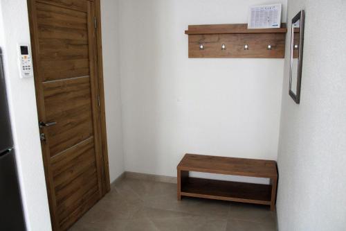 a room with a door and a wooden stool at Apartment Zrnovska Banja 17457b in Korčula