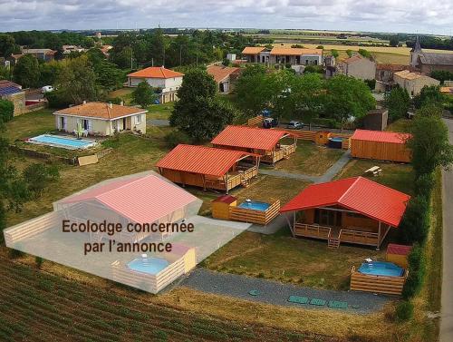 an aerial view of a house with red roofs at Le Carbet Vendéen in Bouillé-Courdault