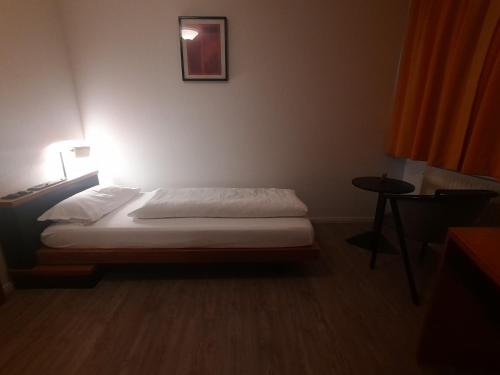 Ένα ή περισσότερα κρεβάτια σε δωμάτιο στο Hotel Lamm