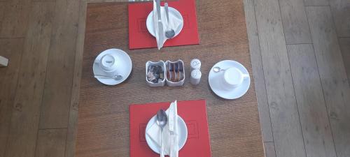 an overhead view of plates and utensils on a table at Victoria Hotel in Portknockie