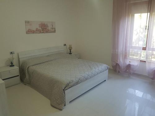 Ένα ή περισσότερα κρεβάτια σε δωμάτιο στο Anna's house Su Planu