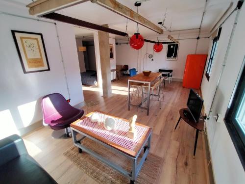 an overhead view of a living room with a table and chairs at Lotila Flats Mieres in Mieres