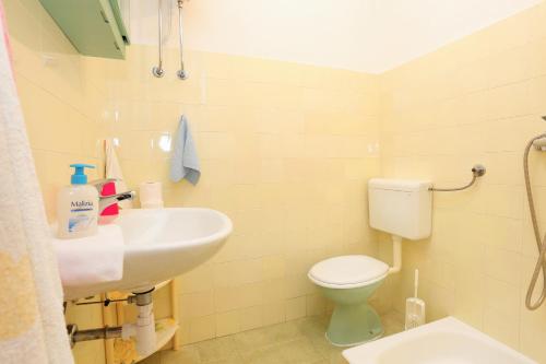 a bathroom with a sink and a toilet at Rooms with a parking space Brela, Makarska - 17281 in Brela