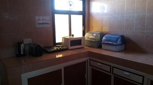 Η κουζίνα ή μικρή κουζίνα στο Sadaf Hotel Apartments