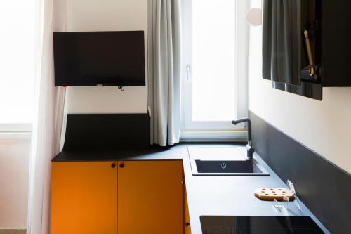 Televízia a/alebo spoločenská miestnosť v ubytovaní JOIVY Smart 1-bed with modern amenities