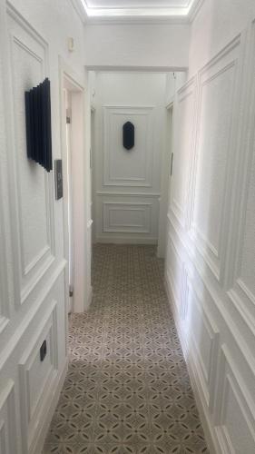 a hallway with a room with a tile floor at Efzen hotel in Istanbul