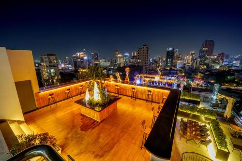 a balcony with a view of a city at night at OCEAN HOTEL in Phnom Penh