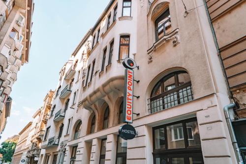 a building with a sign on the side of it at Equity Point Budapest in Budapest