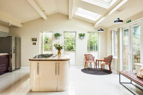 an open kitchen and dining room with skylights at Lux Central Whitby Near Pannett Park/Cinder Trail in Whitby
