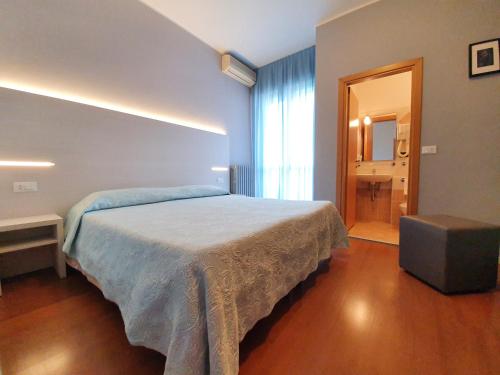 a bedroom with a large bed in a room at Air Hotel in Forlì