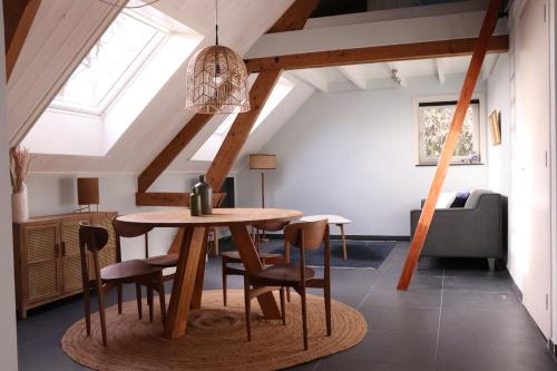 a dining room with a table and chairs at WijkD in Leende