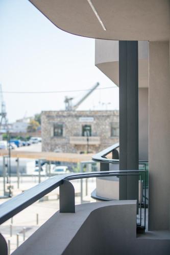a view of a building from a balcony at Souda Plaza Collection in Souda