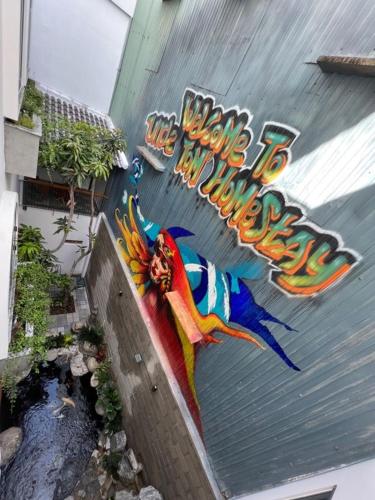 a painting on the side of a building at Tom Homestay Quy Nhơn in Quy Nhon