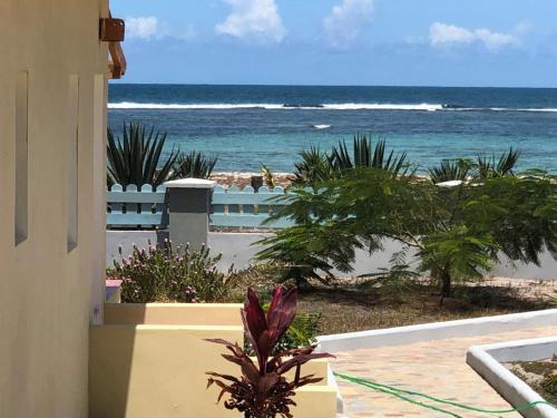 a view of the ocean from a balcony of a beach at Punta Rucia Cristal Beach in Punta Rucia