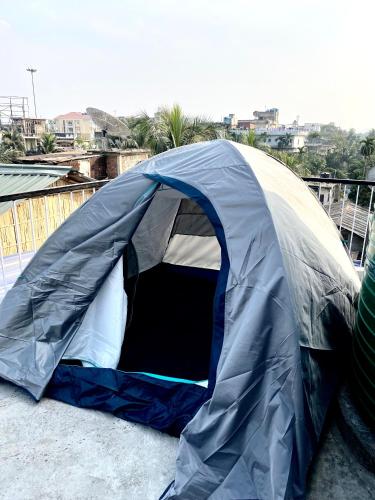 a blue and white tent sitting on the ground at Tridhara HomeStay in Guwahati