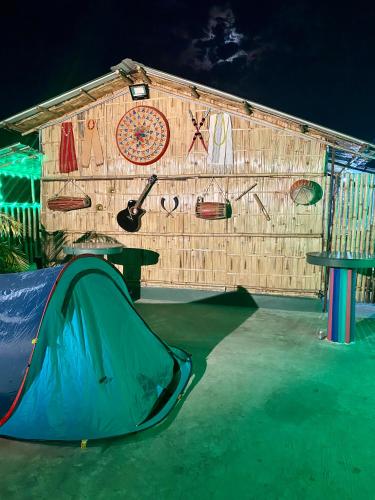 a building with a tent and a clock on it at Tridhara HomeStay in Guwahati
