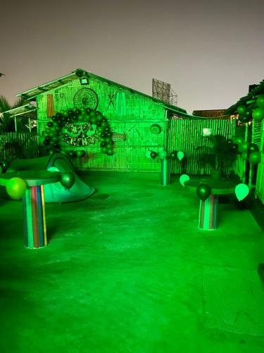 a skateboard park with green lights in front of a building at Tridhara HomeStay in Guwahati