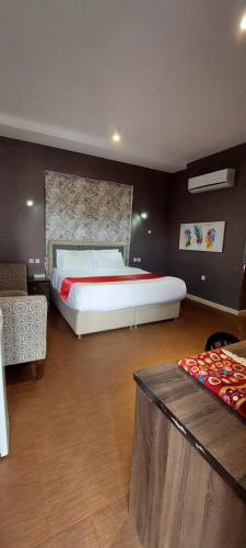 a bedroom with a large bed in a room at EMAN HOUSE in Salalah