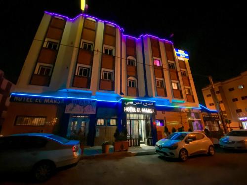 a building with purple lights in front of it at Hotel EL MARSA LA PLAYA in Laayoune