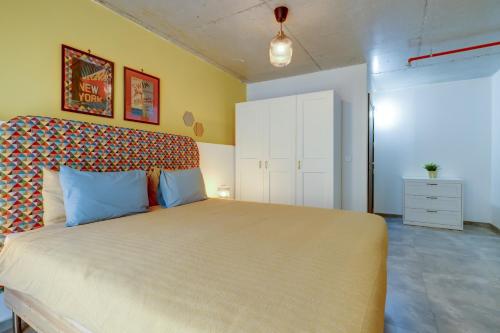 a bedroom with a large bed in a room at Sliema Creek Suites in Sliema