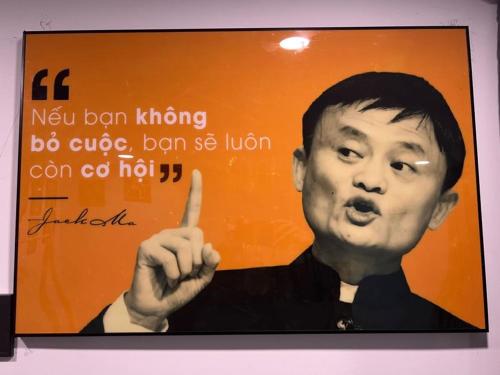 a sign with a picture of a man holding a finger at Tom Homestay Quy Nhơn in Quy Nhon