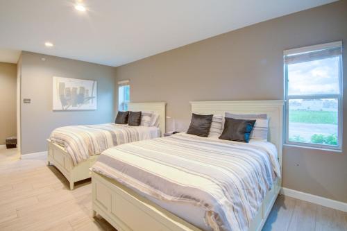 a bedroom with two beds and a window at HS#1- Modern Studio next to Premier Sports Complex in Bradenton