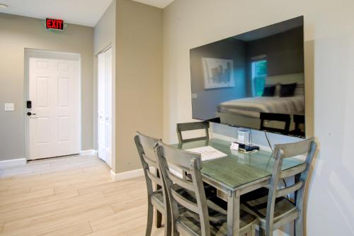 a dining room with a table and chairs and a bed at HS#1- Modern Studio next to Premier Sports Complex in Bradenton