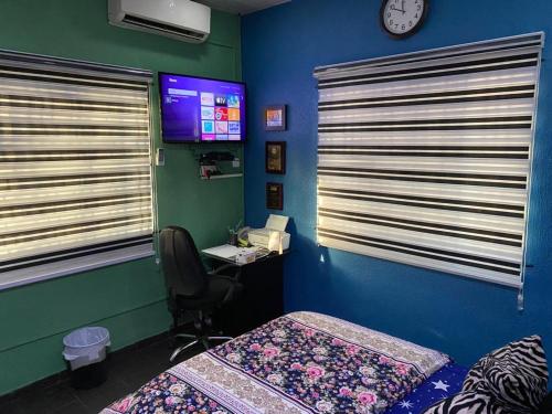 Llit o llits en una habitació de NUMBERS FLIPPERS SERVICES Apartment