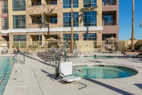 a swimming pool in front of a building at Staybridge Suites Las Vegas - Stadium District in Las Vegas
