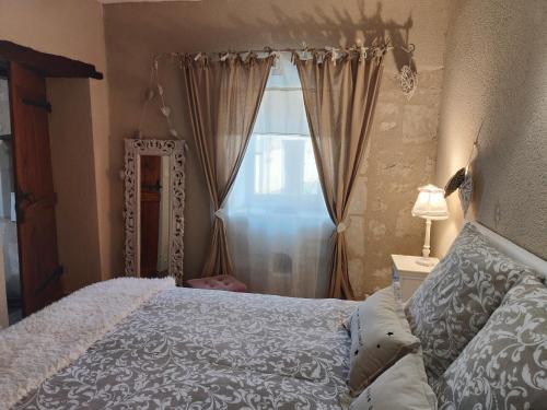 Ein Bett oder Betten in einem Zimmer der Unterkunft Gîte Les Piraudières