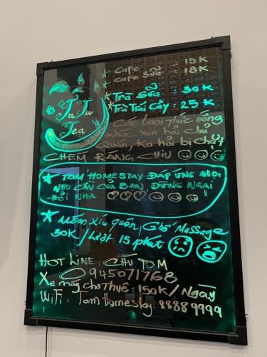 a sign for a restaurant with writing on it at Tom Homestay Quy Nhơn in Quy Nhon