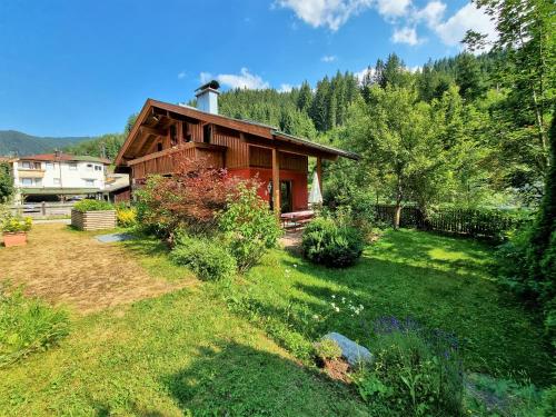 a house with a garden in front of it at Ferienhaus Berghof in Gerlos