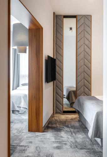 Postel nebo postele na pokoji v ubytování Focus Hotel Premium Kraków