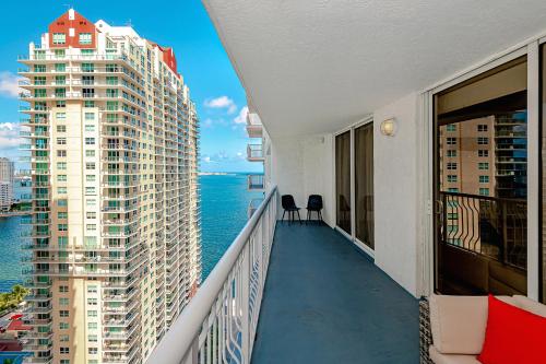 a balcony with a view of the ocean and buildings at Lovely condo with city & ocean views. Sleep up to 6 people! in Miami
