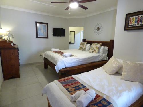 Ένα ή περισσότερα κρεβάτια σε δωμάτιο στο Tsumeb Backpackers & Safari