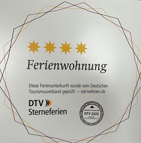 a label for the rennen wolfgang logo at Ferienwohnung Haus Moorblick Garten mit Terrasse Netflix E-Kamin Thermomix in Wiesmoor