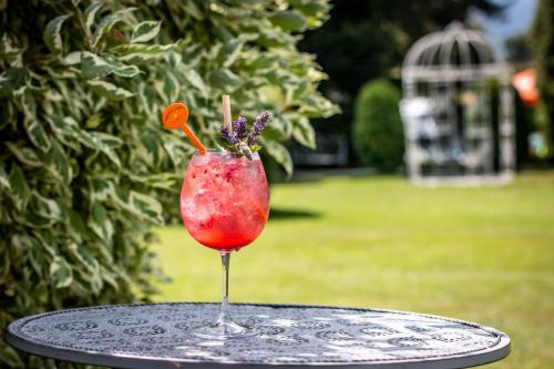 a drink sitting on top of a table at Hotel SLUNEČNÁ LOUKA in Lipno nad Vltavou