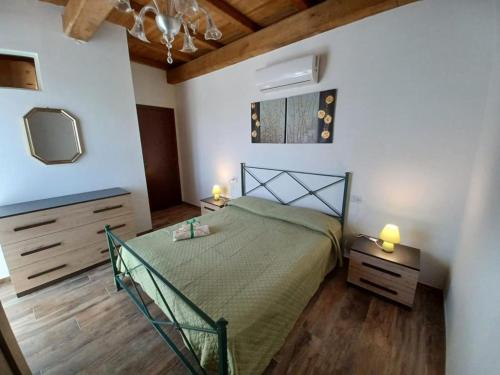 a bedroom with a bed and a dresser and a tv at L'Acero di STALL in Viterbo