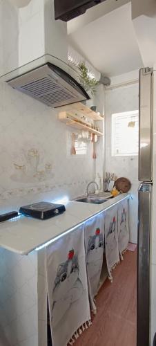 a kitchen with a sink and a counter top at Cuccu homestay in Kiến An