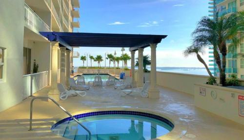 a swimming pool on the side of a building at Lovely condo with city & ocean views. Sleep up to 6 people! in Miami