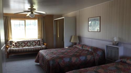 Postelja oz. postelje v sobi nastanitve Twin Lakes Inn