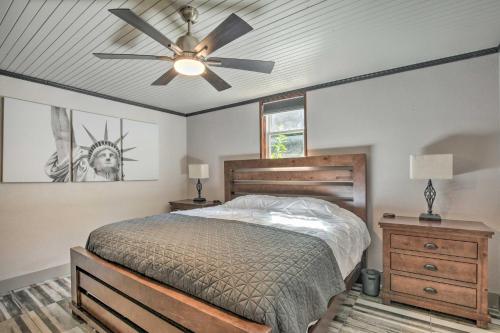 a bedroom with a bed and a ceiling fan at Modern Central Apartment with BBQ Patio and Yard! in Central