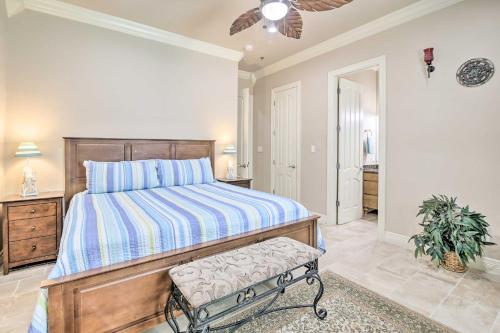 a bedroom with a bed and a ceiling fan at South Padre Island Condo - 200 Ft to Beach! in South Padre Island