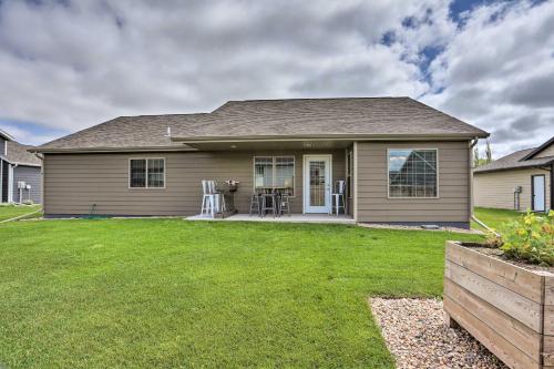 a house with a lawn in front of it at Rapid City Home with Patio Less Than 5 Mi to Downtown! in Rapid City