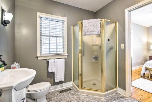 a bathroom with a shower and a toilet and a sink at Idyllic Springfield Haven with Screened Porch! in Springfield