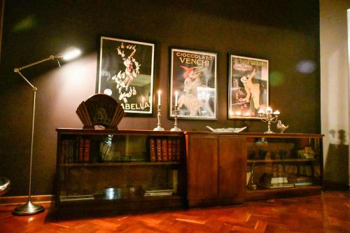 a room with a book shelf with movies on the wall at THE WHITE HOUSE in Johannesburg