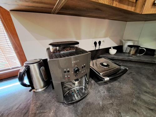 a kitchen with a coffee maker on a counter at Horský Dům Horalka in Železná Ruda
