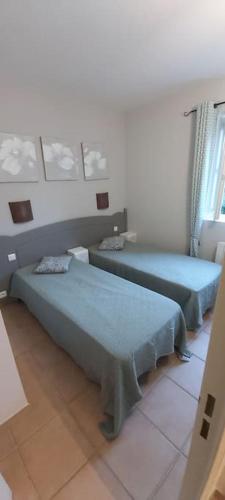 Un ou plusieurs lits dans un hébergement de l'établissement Bastidon Plein Sud