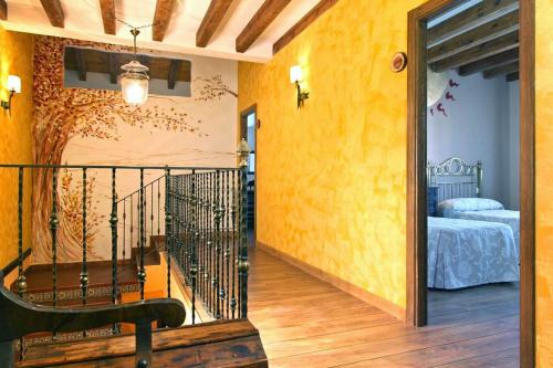 a hallway leading to a bedroom with a bed at La Cantarilla 258 in Aldehuela del Rincón